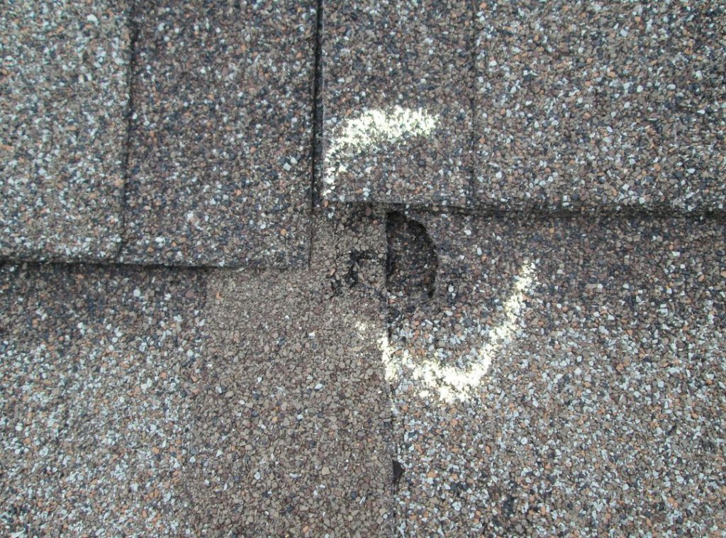 a clear mark of hail damage on roof.